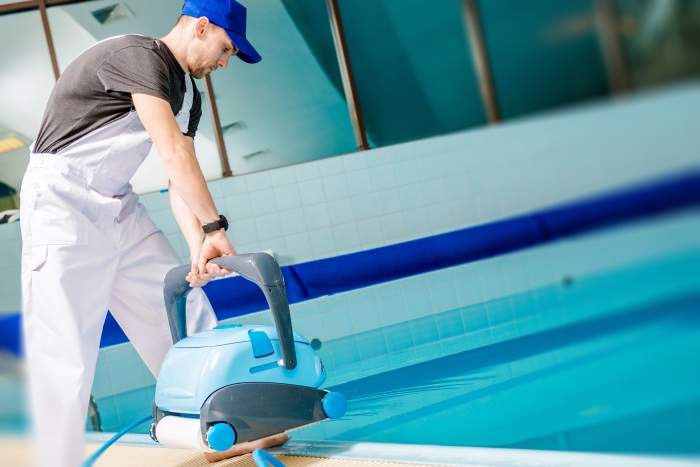 Swimming Pool being Cleaned