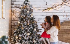 Mum & Daughter Looking at Christmas Tree